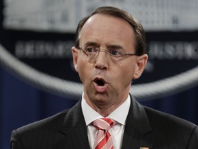 FILE - In this July 13, 2018 file photo, Deputy Attorney General Rod Rosenstein speaks during a news conference at the Department of Justice in Washington. Rosenstein is expected to leave his position soon after William Barr is confirmed as attorney general. That's according to a person familiar with the plans who was not authorized to discuss them on the record and spoke to The Associated Press on condition of anonymity.