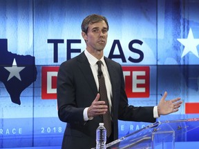 FILE - In this Oct. 16, 2018, file photo, Rep. Beto O'Rourke, D-Texas, takes part in a debate with Sen. Ted Cruz, R-Texas, in San Antonio. O'Rourke barged into last year's Texas Senate race almost laughably early in March 2017. Now, as the onetime punk rocker mulls a much-hyped White House bid for 2020, he's doing anything he can to stay in the spotlight without formally starting a campaign.