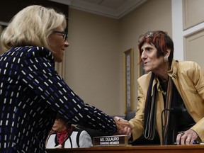 FILE - In this May 24, 2017 file photo, Rep. Rosa DeLauro, D-Conn., center, ranking member on the House Appropriations Labor, Health and Human Services, Education, and Related Agencies subcommittee, greets Education Secretary Betsy DeVos on Capitol Hill in Washington.  House Democrats are preparing to bring Education Secretary Betsy DeVos under the sharpest scrutiny she has seen since taking office. DeVos has emerged as a common target for Democrats as they take charge of House committees that wield oversight powers including the authority to issue subpoenas and call hearings. At least four Democrat-led committees are expected to push DeVos on a range of topics.