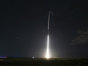 FILE - This Dec. 10, 2018, file photo, provided by the U.S. Missile Defense Agency (MDA),shows the launch of the U.S. military's land-based Aegis missile defense testing system, that later intercepted an intermediate range ballistic missile, from the Pacific Missile Range Facility on the island of Kauai in Hawaii. The Trump administration will roll out a new strategy Thursday, Jan. 17, 2019, for a more aggressive space-based missile defense system to protect against existing threats from North Korea and Iran and counter advanced weapon systems being developed by Russia and China.