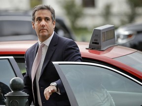 FILE - In this Sept. 19, 2017, file photo, Michael Cohen, President Donald Trump's personal attorney, steps out of a cab during his arrival on Capitol Hill in Washington. Cohen won't appear as scheduled before the House Oversight and Reform Committee on Feb. 7, 2019. Cohen's adviser Lanny Davis says the delay is on the advice of Cohen's lawyers because Cohen's still cooperating in special counsel Robert Mueller's Russia investigation.