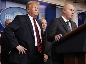 FILE - In this Jan. 3, 2019, file photo, President Donald Trump, left, listens as Brandon Judd, president of the National Border Patrol Council, talks about border security after making a surprise visit to the press briefing room of the White House in Washington. Trump and Judd share an ominous view of the southern border and a certainty that a wall along the boundary is urgently needed to stop what they've described as a humanitarian crisis. Judd, a 21-year veteran of the U.S. Border Patrol, has helped to validate Trump's fiery immigration rhetoric and affirm the president's conviction the border with Mexico is a frequently lawless place.