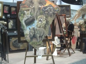 This image provided by the Humane Society of the United States shows a painting on elephant hide for sale at the Safari Club International conference in Reno, Nev., on Jan. 9, 2019. Photos and video taken by animal welfare activists show an array of potentially illicit products crafted from the body parts of threatened big-game animals, including boots, chaps, belts and furniture labeled as elephant leather. The artist told the activists on a video they recorded that the painting was on elephant hide. (Humane Society of the United States via AP)