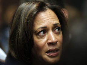 FILE - In this Oct. 22, 2018, file photo, Sen. Kamala Harris, D-Calif., speaks to reporters following a get out the vote rally at Des Moines Area Community College in Ankeny, Iowa. As she nears a decision on whether to seek the presidency, Harris is striking a delicate balance on what could be a hurdle in a Democratic primary: her past as a prosecutor.
