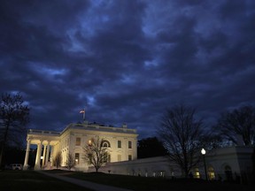In this Jan. 8, 2019, photo, clouds roll over the White House, Tuesday Jan. 8, 2019, in Washington. The 2020 primary campaign is exploding 13 months before the first voters head to the polls. Candidates and potential candidates are hiring staff and traveling to key states all in a mad scramble to gain a leg up in what will be a rollicking Democratic primary.