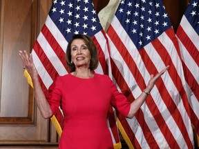 In this Jan. 3, 2019, photo, House Speaker Nancy Pelosi of Calif., gestures before a ceremonial swearing-in on Capitol Hill in Washington, during the opening session of the 116th Congress. House Democrats are unveiling a comprehensive elections and ethics reform package that takes aim at what they call "the culture of corruption in Washington" and reduces the role of money in politics.