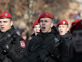 Members of the police forces of the Republic of Srpska march during a parade marking the 27th anniversary of the Republic of Srpska in the Bosnian town of Banja Luka, Wednesday, Jan. 9, 2019.  In a show of nationalist defiance, Bosnian Serbs are celebrating a controversial holiday despite strong opposition from other ethnic groups in Bosnia who view it as discriminatory. Waving Serb flags, several thousand people on Wednesday lined up in the main Serb city of Banja Luka to watch a celebratory parade of security troops, firefighters, cultural and sport groups.