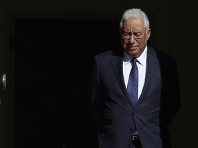 In this photo taken Jan. 17, 2019, Portugal's Prime Minister Antonio Costa walks to the door of the Sao Bento palace in Lisbon. On Friday, Jan. 25, 2019, the speaker of Portugal's parliament has appealed for calm during a session debating racial tensions and police conduct after the prime minister asked whether his own skin color had prompted a lawmaker's questions. Costa, whose father's family is from India, said to the lawmaker, "It must be because of my skin color that you're asking me whether I condemn or don't condemn" police violence. The comment caused an uproar.