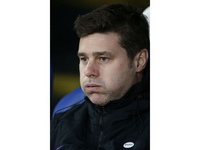 Tottenham manager Mauricio Pochettino sits on the bench during an English FA Cup fourth round soccer match between Crystal Palace and Tottenham Hotspur at Selhurst Park in London, Sunday, Jan. 27, 2019.