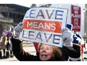Pro and Anti Brexit protesters demonstrate outside the Houses of Parliament in London, Monday, Jan. 28, 2019. British Prime Minister Theresa May faces another bruising week in Parliament as lawmakers plan to challenge her minority Conservative government for control of Brexit policy.