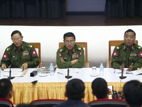 Maj. Gen.Nyi Nyi Tun, vice chairman of the Myanmar's military information committee, left, Maj. Gen. Soe Naing Oo, chairman of the Myanmar's military information committee, center, and Brig. Zaw Min Tun, secretary of the Myanmar's military information committee, attend a press conference at the Military Museum in Naypyitaw, Myanmar, Friday, Jan. 18, 2019.