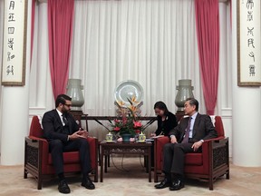 Afghanistan National Security Advisor Hamdullah Mohib, left, talks to the Chinese Foreign Minister Wang Yi during their meeting at the Zhongnanhai Leadership Compound in Beijing, Thursday, Jan. 10, 2019.