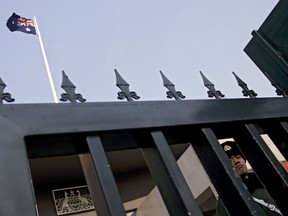 A Chinese paramilitary policeman stands guard at the Australian Embassy in Beijing, Thursday, Jan. 24, 2019. Australia's foreign minister has urged China to treat a Chinese-Australian writer fairly and says there is no evidence that his detention is part of a backlash against Canada's arrest of a top Chinese telecommunications executive.