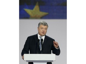 Ukrainian President Petro Poroshenko gestures while speaking at a meeting with supporters in Kiev, Ukraine, Tuesday, Jan. 29, 2019. Poroshenko declared his intention to run for re-election in March's presidential vote.