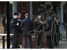 A group of police officer is seen through a glass door at the Tretyakov State Gallery museum in Moscow, Russia, Sunday, Jan. 27, 2019. Russia's ministry of culture has estimated the insurance value of Arkhip Kuindzhi's Ai Petri. Crimea painting that was stolen from the gallery on Sunday at 12 million rubles (some 181,860 US dollars), director of the ministry's museums department Vladislav Kononov told TASS.