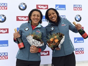 Elana Meyers Taylor, right and Sylvia Hoffmann from the United States celebrate their third place after the second run of the two-woman bobsled World Cup race in Igls, near Innsbruck, Austria, Saturday, Jan. 19, 2019.