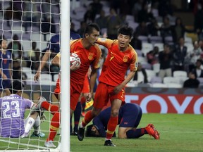 China's forward Xiao Zhi celebrates after scoring his side's opening goal during the AFC Asian Cup round of 16 soccer match between Thailand and China at the Hazza Bin Zayed stadium in Al Ain, United Arab Emirates, Sunday, Jan. 20, 2019.