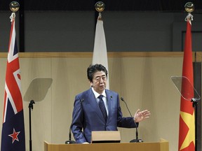 Japan's Prime Minister Shinzo Abe delivers a speech during an opening session of the Comprehensive and Progressive Trans-Pacific Partnership (CPTPP) in Tokyo, Saturday, Jan. 19, 2019. Trade ministers of a Pacific Rim trade bloc are meeting in Tokyo gearing up to roll out and expand the market-opening initiative.