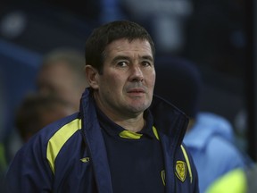 Burton Albion's manager Nigel Clough looks on during the English League Cup semi-final first leg soccer match between Manchester City and Burton Albion at the Etihad Stadium in Manchester, England, Wednesday, Jan. 9, 2019.