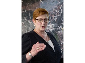 Australia's Foreign Minister Marise Payne gestures as she answers a journalist's question in Bangkok, Thailand, Thursday, Jan. 10, 2019. Visiting Thailand on Thursday, Payne praised her hosts for their handling of the case of the young Saudi woman fleeing her family to seek asylum in Australia, but said she also reminded them of continuing concern about a Bahraini soccer player granted asylum in Australia who is in Thai detention.