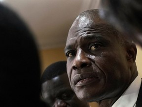 Congolese opposition presidential candidate Martin Fayulu delivers a statement at his headquarters in Kinshasa, Congo, Tuesday Jan. 8, 2019. As Congo anxiously awaits the outcome of the presidential election, many in the capital say they are convinced that the opposition won and that the delay in announcing results is allowing manipulation in favor of the ruling party.