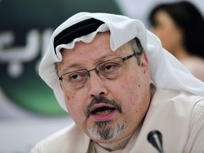 FILE - In this Dec. 15, 2014 file photo, Saudi journalist Jamal Khashoggi speaks during a press conference in Manama, Bahrain. Turkish Foreign Minister Mevlut Cavusoglu said late Monday, Jan. 21, 2019 that Turkey is preparing to take steps to launch an international investigation into the killing of Khashoggi. The Washington Post columnist, who wrote critically about the Saudi crown prince, was killed inside the Saudi Consulate in Istanbul in October 2018.