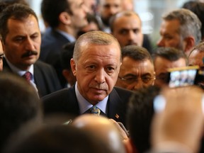 Turkey's President Recep Tayyip Erdogan leaves after delivering a speech to MPs of his ruling Justice and Development Party (AKP) at the parliament in Ankara, Turkey, Tuesday, Jan. 15, 2019.