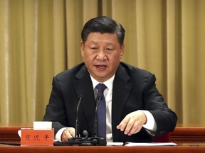 Chinese President Xi Jinping speaks during an event to commemorate the 40th anniversary of the Message to Compatriots in Taiwan at the Great Hall of the People in Beijing, Wednesday, Jan. 2, 2019. Xi urged both sides to reach an early consensus on the unification of China and Taiwan and not leave the issue for future generations.