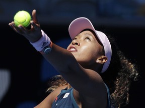 Japan's Naomi Osaka serves to Taiwan's Hsieh Su-Wei during their third round match at the Australian Open tennis championships in Melbourne, Australia, Saturday, Jan. 19, 2019.