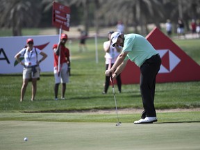 Shane Lowry of Ireland follows the ball after putting on the 9th green in round one of the Abu Dhabi Championship golf tournament, in Abu Dhabi, United Arab Emirates, Wednesday, Jan. 16, 2019.