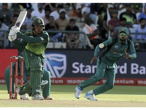 South Africa's batsman Quinton de Kock, left, at the wicket in front of Pakistan's Babar Azam, right, during their ODI cricket match between South Africa and Pakistan at the Newland's Cricket Ground in Cape Town, South Africa, Wednesday, Jan 30, 2019..