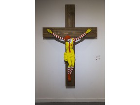 An artwork called "McJesus," which was sculpted by Finnish artist Jani Leinonen and depicts a crucified Ronald McDonald, is seen on display as part of the Haifa museum's "Sacred Goods" exhibit, in Haifa, Israel, Monday, Jan. 14, 2019. Hundreds of Christians calling for the sculpture's removal protested at the museum last week.