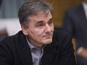 Greek Finance Minister Euclid Tsakalotos attends a Cabinet Meeting inside the Greek Parliament in Athens, Monday, Jan. 28, 2019. Greece announced plans to issue a 5-years bond, in the first market test since the end of its international Bailout last August.