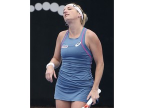 Timea Bacsinszky of Switzerland tilts her head back after missing a shot to Aliaksandra Sasnovich of Belarus during their women's singles match at the Sydney International tennis tournament in Sydney, Thursday, Jan. 10, 2019.