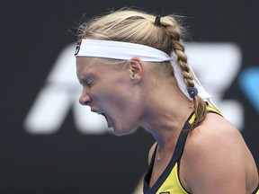 Kiki Bertens of the Netherlands yells out while playing Ash Barty of Australia during their women's singles semifinal match at the Sydney International tennis tournament in Sydney, Friday, Jan. 11, 2019.