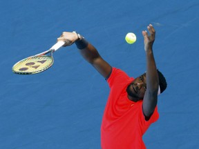 Frances Tiafoe of the United States serves during his match against Britain's Cameron Norrie at the Hopman Cup in Perth, Australia, Thursday Jan. 3, 2019.