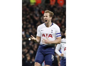 Tottenham's Harry Kane celebrates after scoring his side first goal during the English League Cup semifinal first leg soccer match between Tottenham Hotspur and Chelsea at Wembley Stadium in London, Tuesday, Jan. 8, 2019.