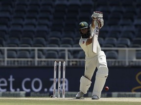South Africa's batsman Hashim Amla plays a shot on day three of the third cricket test match between South Africa and Pakistan at the Wanderers stadium in Johannesburg, South Africa, Sunday, Jan. 13, 2019.