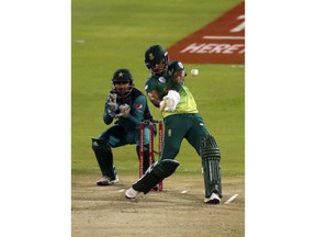 South Africa's Reeza Hendricks, right, plays a shot as Pakistan's captain Sarfraz Ahmed watches on during the second One Day International cricket match between South Africa and Pakistan at Centurion Park in Pretoria, South Africa, Friday, Jan. 25, 2019.