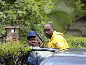 Evan Mawarire, an activist and pastor who helped mobilize people to protest against the hike in fuel prices, is arrested at his residence in Harare, Zimbabwe, Wednesday, Jan. 16, 2019. Mawarire was arrested Wednesday for allegedly inciting violence in the protests against the government's increase in fuel prices.
