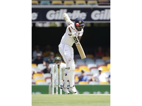 Sri Lanka's Lahiru Thirimanne is hit by the ball during the test match between Australia and Sri Lanka in Brisbane, Australia, Thursday, Jan. 24, 2019.