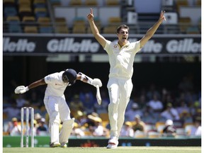 Australia's Pat Cummins appeals for the wicket of Sri Lanka's Roshen Silva, left, during the cricket test match between Australia and Sri Lanka in Brisbane, Australia, Saturday, Jan. 26, 2019.