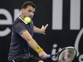 Grigor Dimitrov of Bulgaria plays a shot during his match against John Millman of Australia at the Brisbane International tennis tournament in Brisbane, Australia, Wednesday, Jan. 2, 2019.