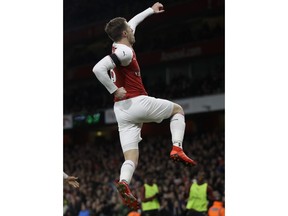 Arsenal's Aaron Ramsey celebrates after scoring his side's third goal during the English Premier League soccer match between Arsenal and Fulham at Emirates stadium in London, Tuesday, Jan. 1, 2019.