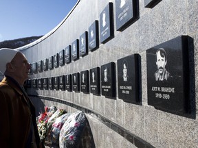 Kosovo Albanian Limon Hajdini visits the commemorative wall dedicated to the victims of the Recak massacre in the village of Recak, Kosovo on Tuesday, Jan. 15, 2019. Kosovo Albanians gathered in the village of Racak on Thursday to mark the 20th anniversary of the massacre of more than 40 ethnic Albanians by Serb security forces.