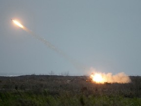 A rocket is fired from a Thunderbolt 2000 multi-rocket launcher during a military exercises in Taichung, central Taiwan, Thursday, Jan. 17, 2019. Taiwan's military has conducted a live-fire drill on Thursday to show its determination to defend itself from Chinese threats.