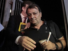 In this file photo taken on March 13, 2015 Cesare Battisti leaves the Federal Police headquarters in Sao Paulo, Brazil.