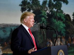 U.S. President Donald Trump makes a statement about immigration and the border wall from the diplomatic reception room of the White House.