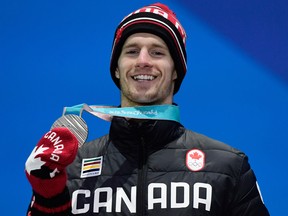 Canada's silver medallist Max Parrot poses on the podium during the medal ceremony for the snowboard Men's Slopestyle during the Pyeongchang 2018 Winter Olympic Games.
