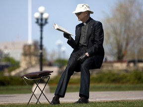 Father Anthony Van Hee, seen on the lawn of Parliament Hill in a file photo from 2010, has been carrying out a peaceful pro-life vigil there for nearly 30 years.